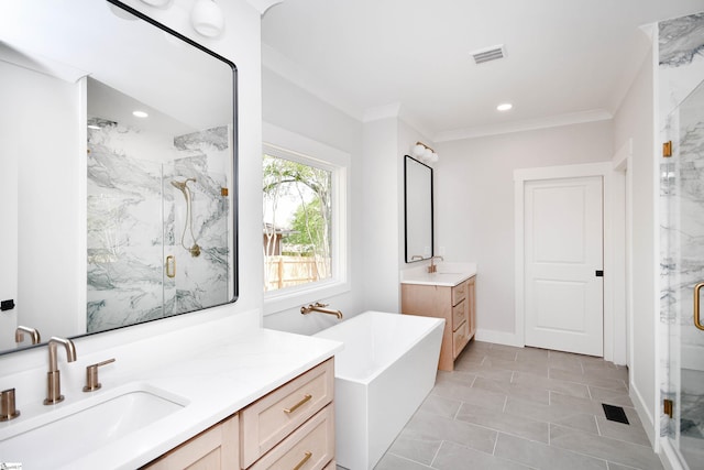 bathroom featuring visible vents, a sink, ornamental molding, a marble finish shower, and two vanities
