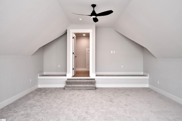 bonus room featuring baseboards, a ceiling fan, vaulted ceiling, and carpet floors
