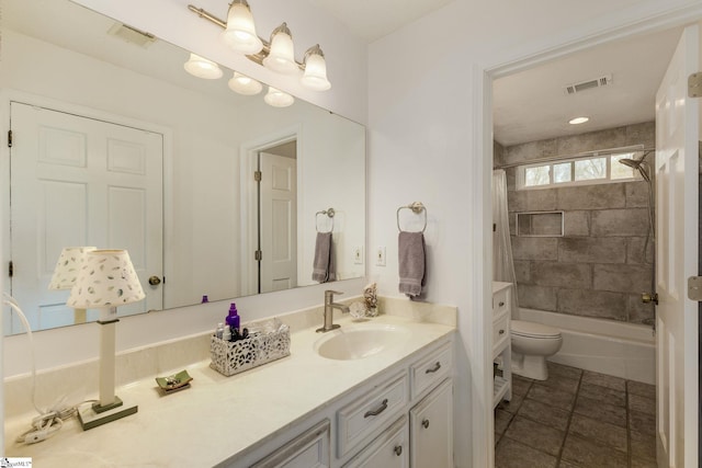 bathroom with shower / bath combo, vanity, visible vents, and toilet