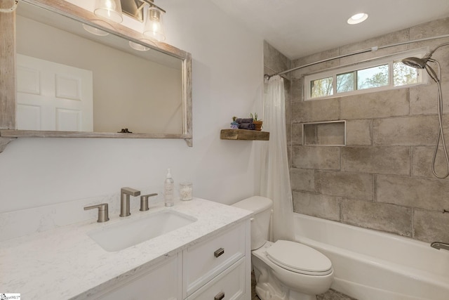 full bathroom with shower / bathtub combination with curtain, vanity, and toilet