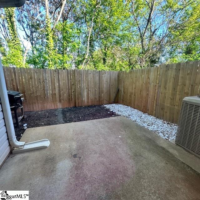 view of patio / terrace with central AC unit, a fenced backyard, and area for grilling