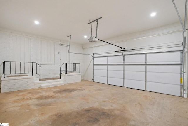 garage featuring a garage door opener and recessed lighting