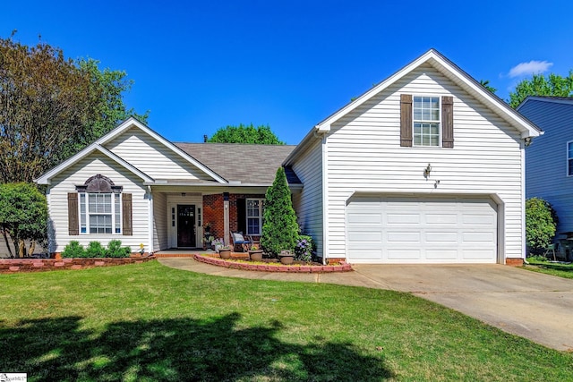 view of front of house with concrete driveway, a garage, a front lawn, and covered porch