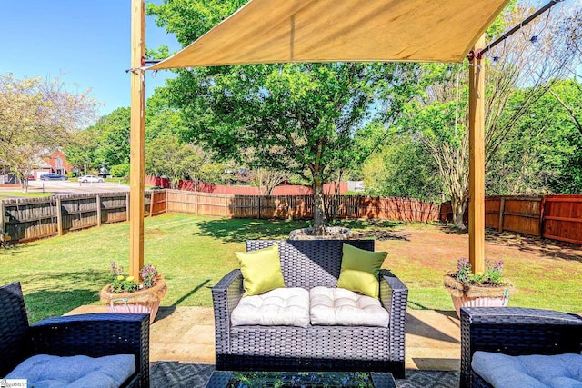 view of yard featuring a patio, a fenced backyard, and an outdoor hangout area