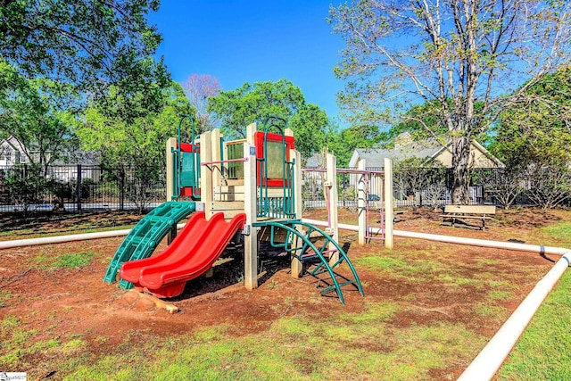 communal playground featuring fence