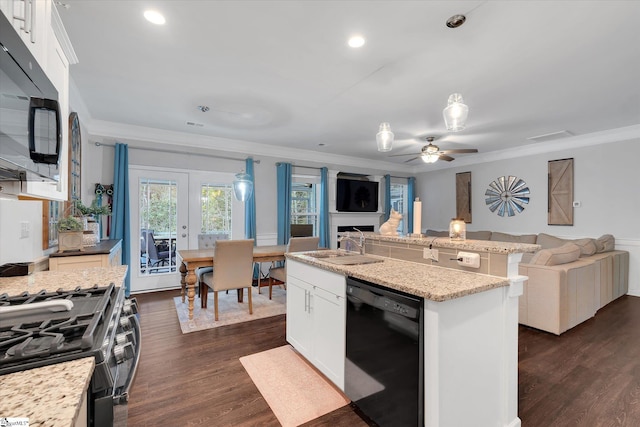 kitchen with dark wood-type flooring, open floor plan, black appliances, and ornamental molding
