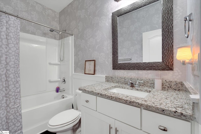 full bathroom with toilet, shower / bath combo, wallpapered walls, and vanity