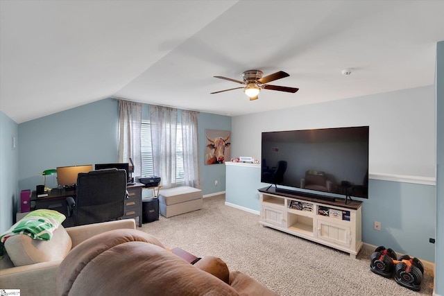 carpeted living area with lofted ceiling, baseboards, and ceiling fan