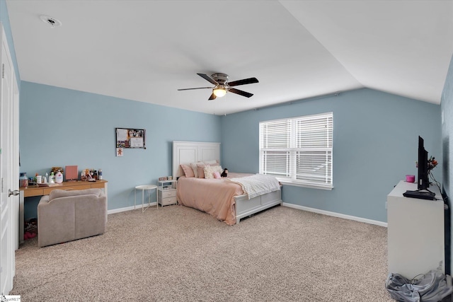 carpeted bedroom with baseboards, a ceiling fan, and vaulted ceiling