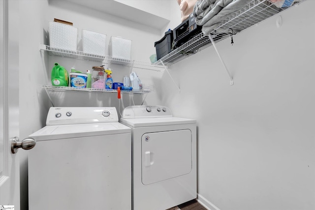 washroom featuring laundry area and washing machine and dryer