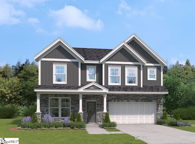 craftsman-style home featuring board and batten siding, an attached garage, stone siding, and driveway