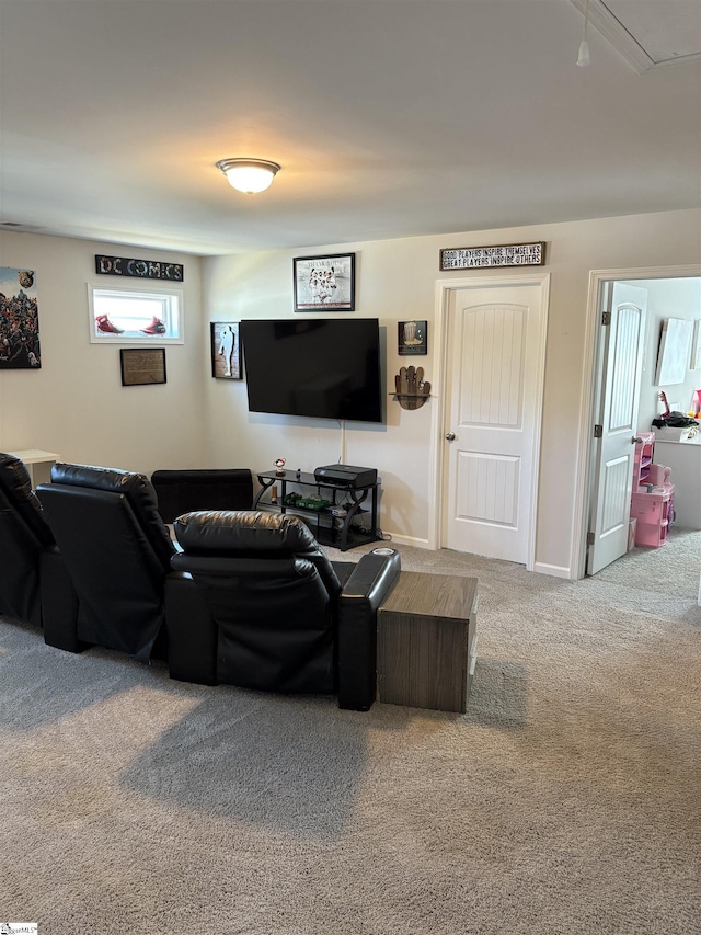 living area with attic access, carpet floors, and baseboards