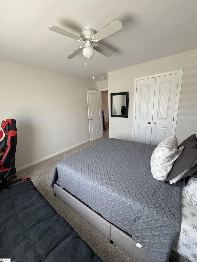 bedroom featuring carpet floors, a closet, a ceiling fan, and baseboards