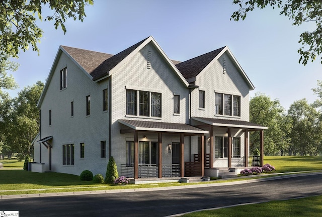 modern farmhouse featuring a standing seam roof, cooling unit, covered porch, a front yard, and brick siding