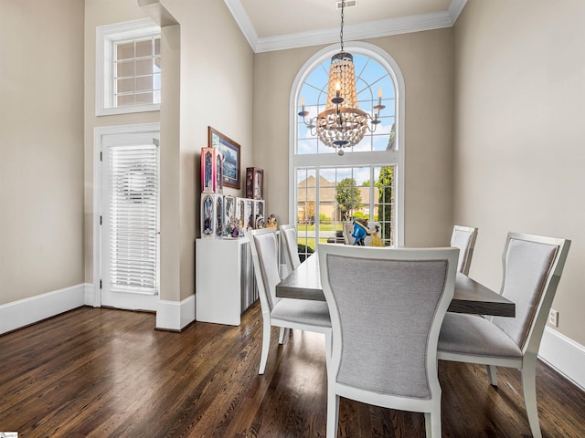 dining space with crown molding, an inviting chandelier, dark wood finished floors, and a wealth of natural light