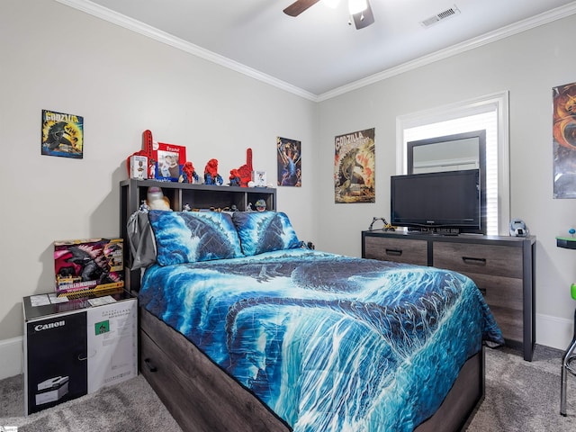 carpeted bedroom featuring ceiling fan, baseboards, ornamental molding, and visible vents