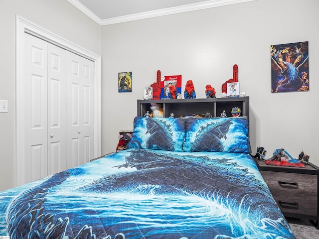 bedroom with crown molding and a closet