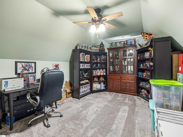 carpeted office with ceiling fan, visible vents, and lofted ceiling