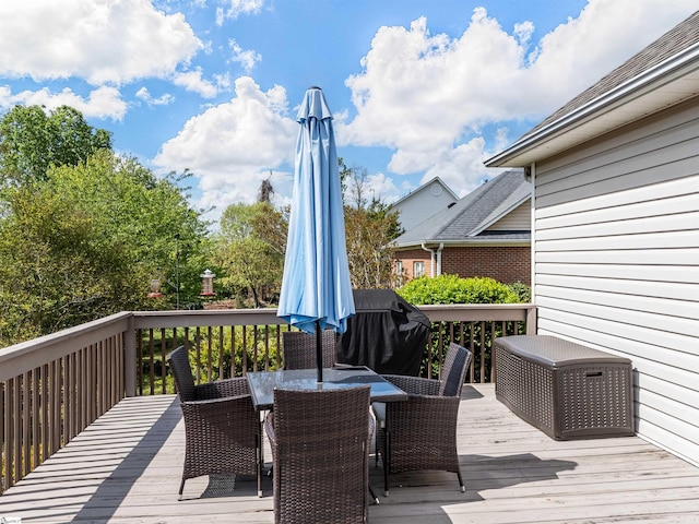 deck featuring outdoor dining area