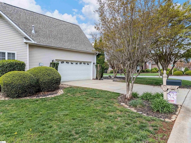 view of home's exterior with driveway, an attached garage, a lawn, and roof with shingles