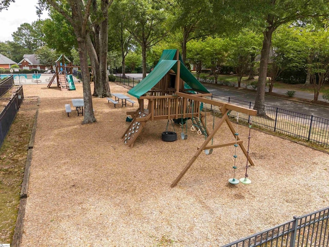 communal playground featuring fence