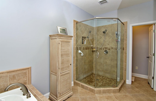 bathroom with visible vents, baseboards, a closet, tile patterned flooring, and a stall shower