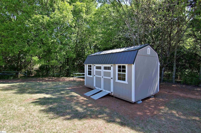 view of shed featuring a forest view