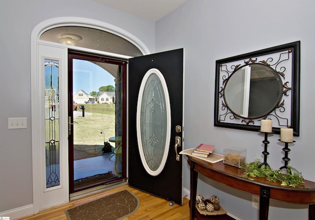 foyer featuring light wood-type flooring and baseboards