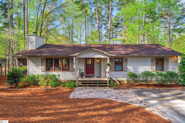 323 Long Reach Dr, Salem, SC 29676 - ranch-style house with a shingled roof, covered porch, and a chimney