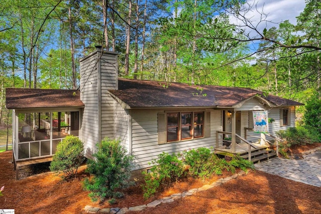 323 Long Reach Dr, Salem, SC 29676 - view of front facade with a shingled roof, a sunroom, and a chimney