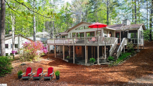323 Long Reach Dr, Salem, SC 29676 - back of property with a chimney, a deck, a sunroom, and stairs