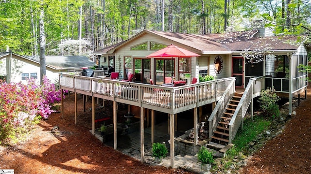 323 Long Reach Dr, Salem, SC 29676 - rear view of house featuring a sunroom, a chimney, a wooden deck, and stairs