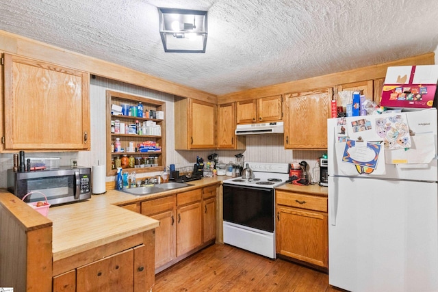525 Firetower Rd, Williamston, SC 29697 - kitchen with white appliances, light countertops, a textured ceiling, under cabinet range hood, and a sink