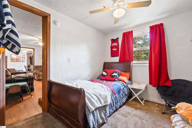 525 Firetower Rd, Williamston, SC 29697 - bedroom featuring a textured ceiling, ceiling fan, and baseboards