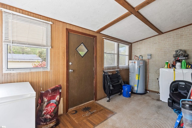525 Firetower Rd, Williamston, SC 29697 - washroom with laundry area, a textured ceiling, electric water heater, brick wall, and wooden walls