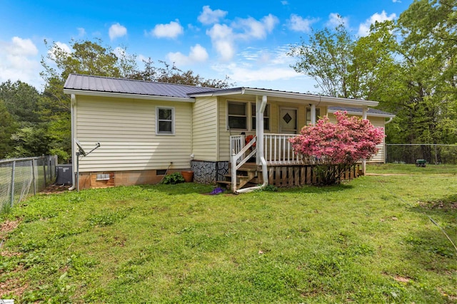 525 Firetower Rd, Williamston, SC 29697 - rear view of property featuring crawl space, a yard, a porch, metal roof, and fence