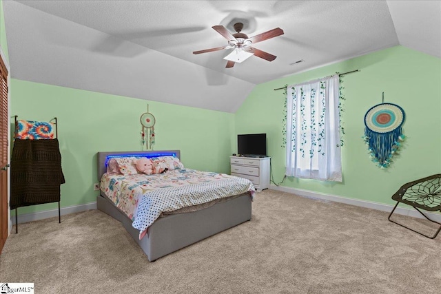 bedroom with baseboards, carpet, and vaulted ceiling