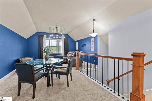 dining area featuring baseboards, carpet flooring, and vaulted ceiling