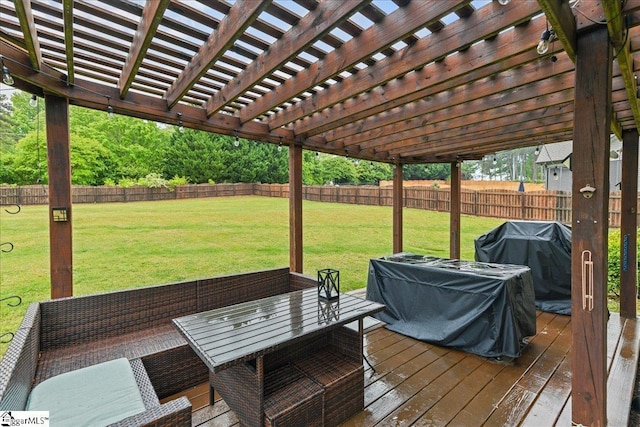 wooden terrace featuring a grill, a pergola, fence, and a lawn