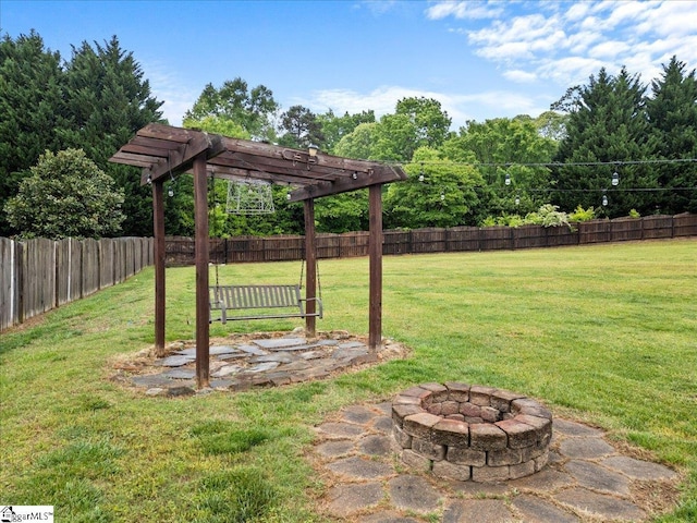view of yard with a fenced backyard and an outdoor fire pit