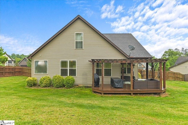 rear view of house featuring a pergola, a fenced backyard, a wooden deck, and a lawn