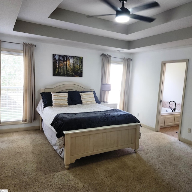 670 Secretariat Dr, Boiling Springs, SC 29316 - carpeted bedroom featuring a raised ceiling, baseboards, and multiple windows