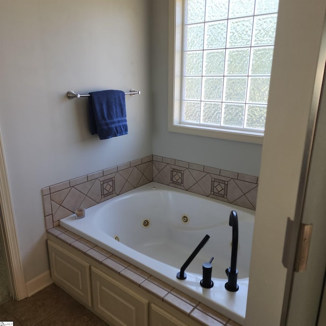 670 Secretariat Dr, Boiling Springs, SC 29316 - bathroom featuring a whirlpool tub and tile patterned flooring