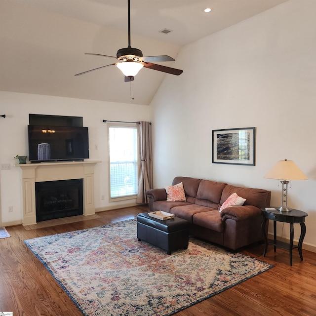 670 Secretariat Dr, Boiling Springs, SC 29316 - living area featuring baseboards, a ceiling fan, wood finished floors, and a fireplace with flush hearth
