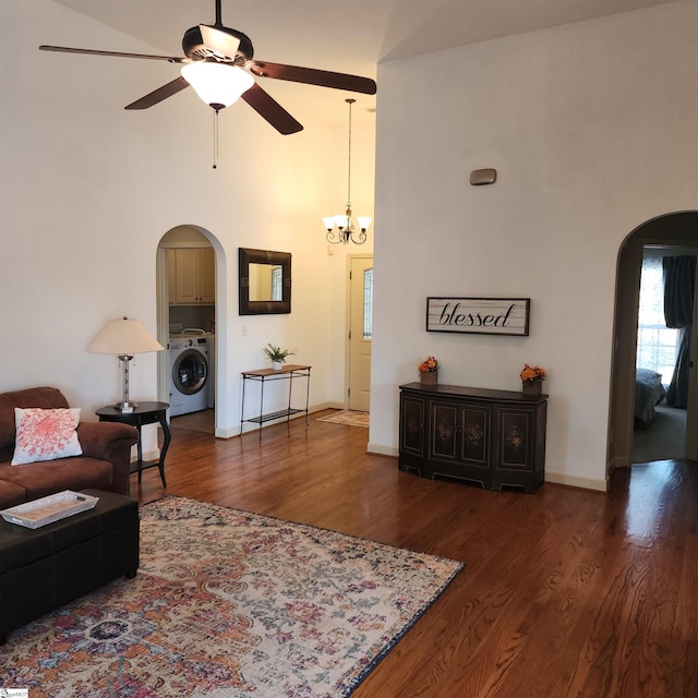 670 Secretariat Dr, Boiling Springs, SC 29316 - living room featuring a towering ceiling, washer / dryer, arched walkways, ceiling fan with notable chandelier, and wood finished floors