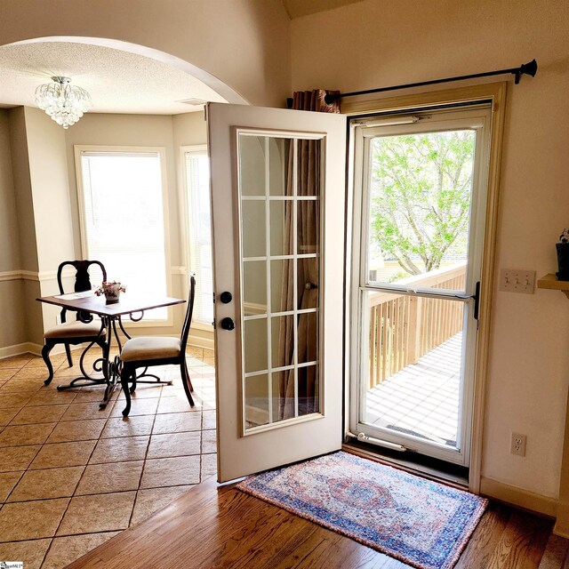 670 Secretariat Dr, Boiling Springs, SC 29316 - entryway featuring baseboards, arched walkways, and wood finished floors