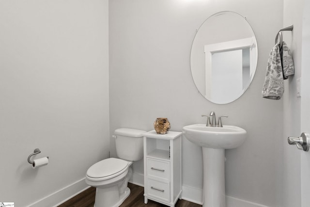 901 Whitemarsh Ave, Simpsonville, SC 29680 - bathroom with a sink, toilet, wood finished floors, and baseboards