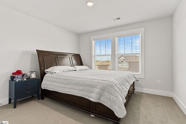 901 Whitemarsh Ave, Simpsonville, SC 29680 - bedroom featuring light colored carpet, baseboards, and visible vents