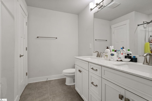 901 Whitemarsh Ave, Simpsonville, SC 29680 - full bathroom featuring tile patterned floors, double vanity, baseboards, and a sink