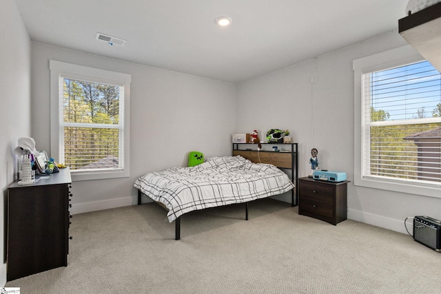 901 Whitemarsh Ave, Simpsonville, SC 29680 - bedroom featuring visible vents, baseboards, multiple windows, and light carpet